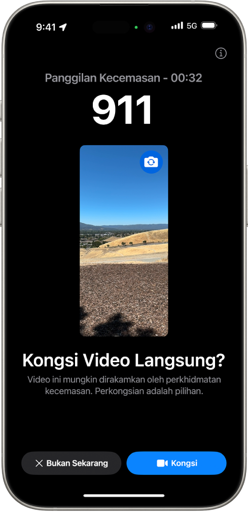 Skrin Video Langsung SOS Kecemasan menunjukkan panggilan telefon kecemasan 911 dengan pratonton video di bahagian tengah. Di bahagian bawah ialah butang Bukan Sekarang dan Kongsi Video.